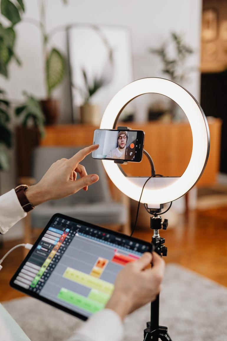 Shallow focus photo of a man making a vlog